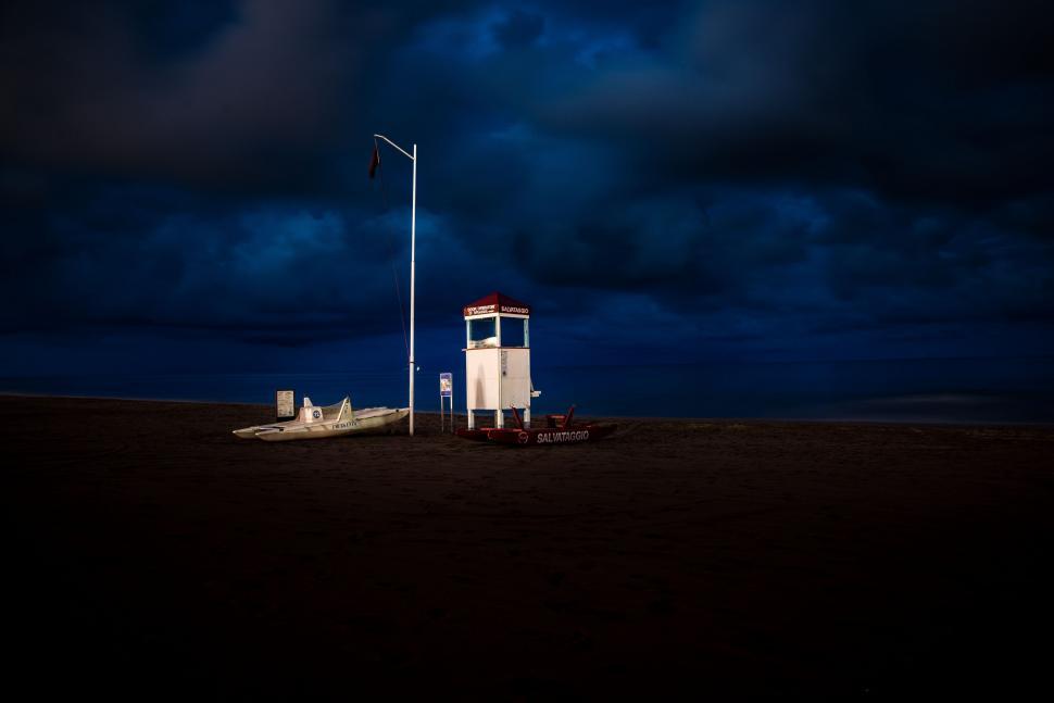 Free Image of White Tower on Sandy Beach 