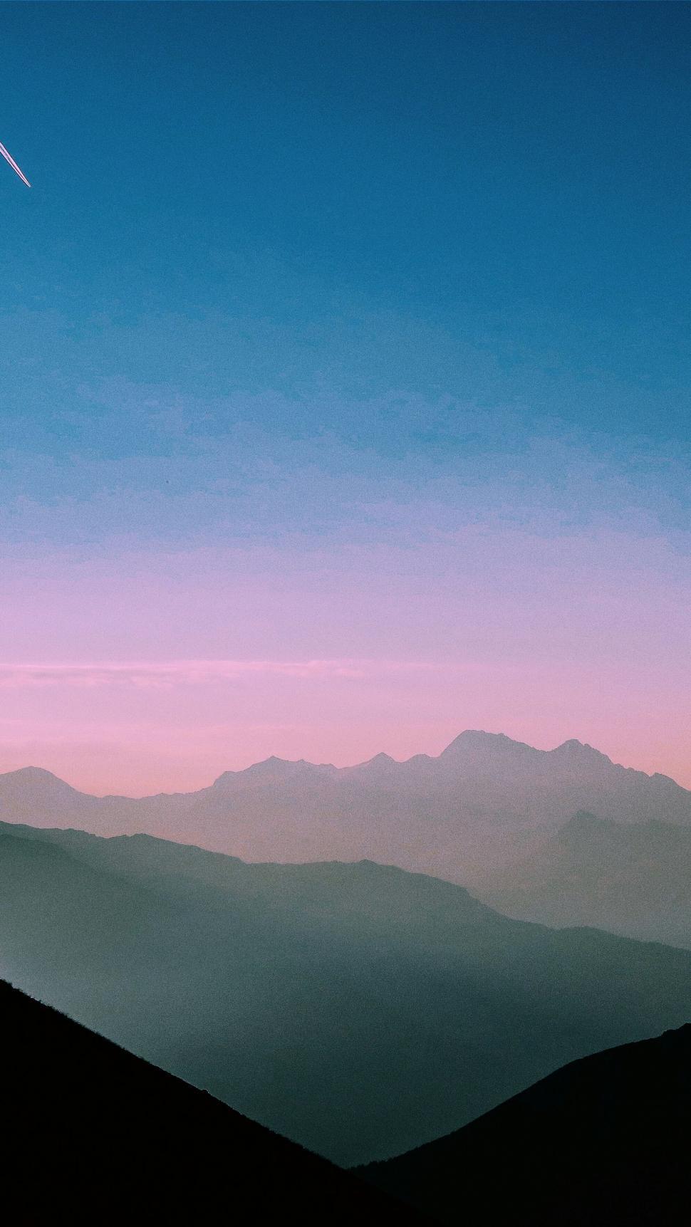 Free Image of Plane Flying Over Mountain Range 