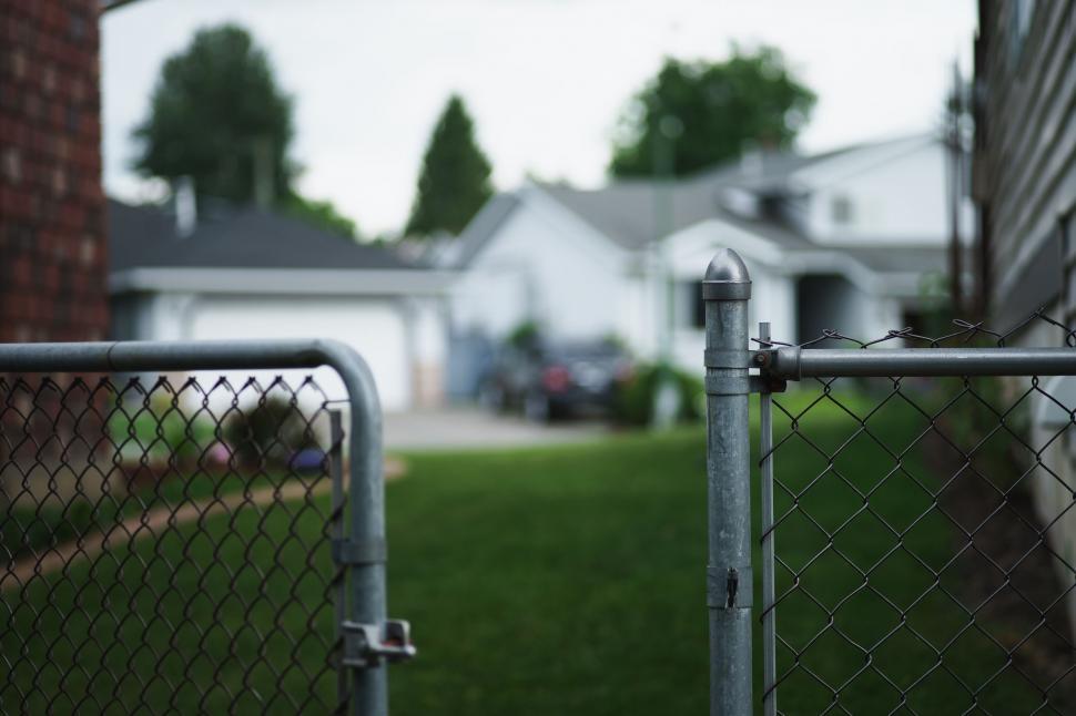 Free Image of Chain Link Fence With House in Background 