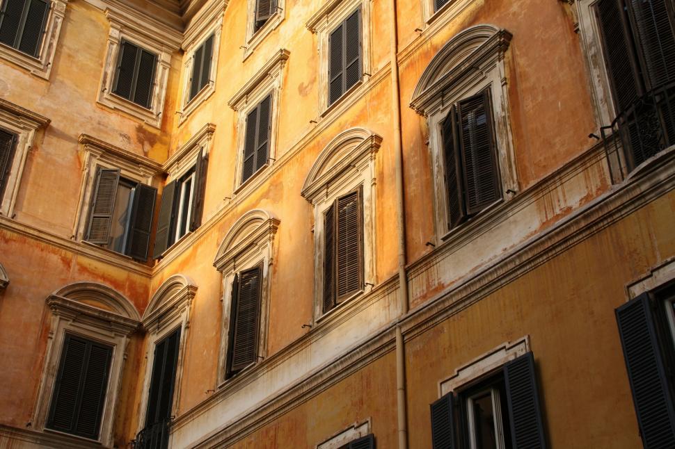 Free Image of Modern Office Building With Large Windows and Shutters 