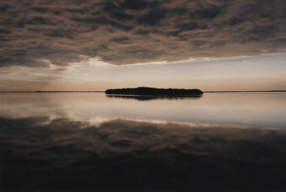Free Image of Small Island Amidst Body of Water 