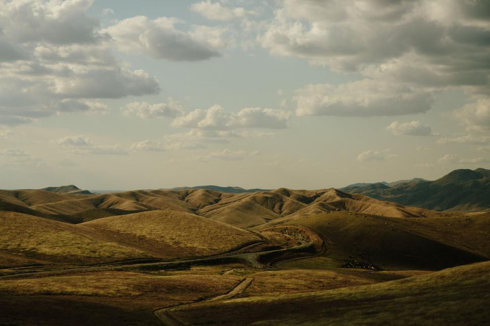 Free Image of Majestic Mountain Range Under Cloudy Sky 