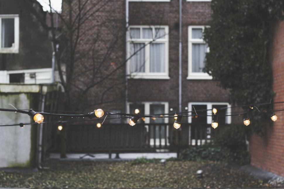 Free Image of String of Lights Hanging on Wire 