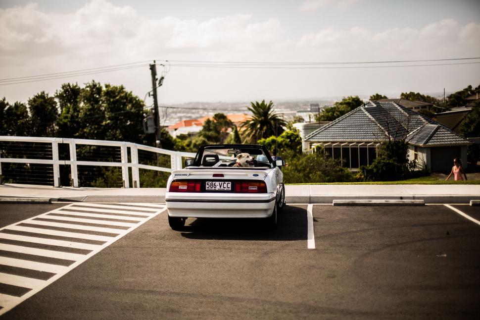 Free Image of White Car Parked in Parking Lot 
