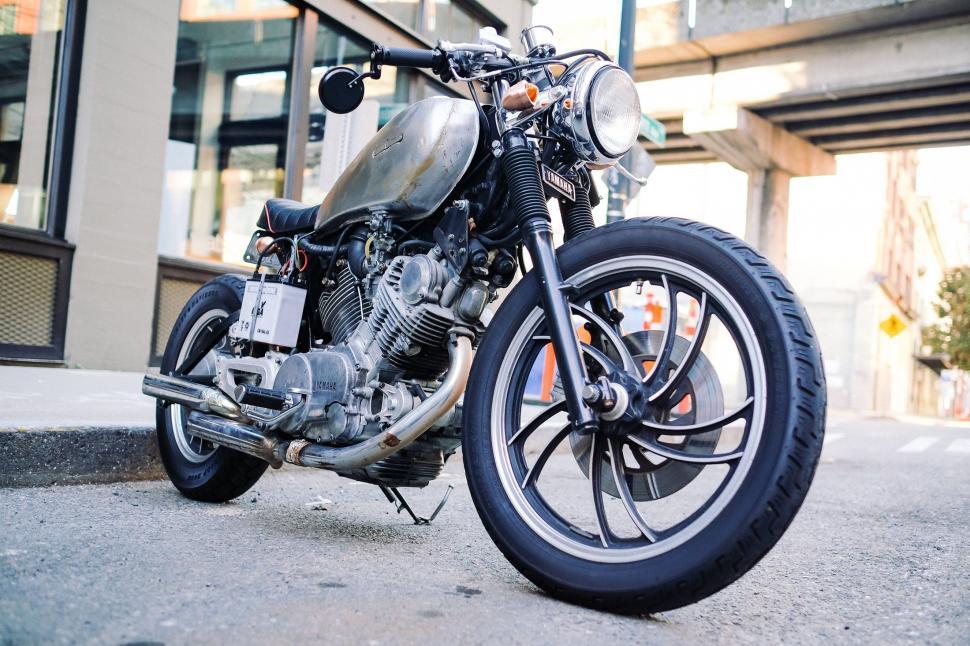 Free Image of Motorcycle Parked in Front of Building 