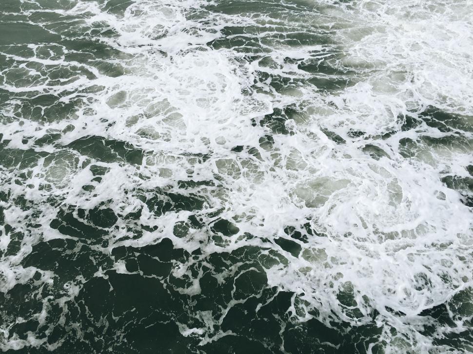 Free Image of Ocean Waves Crashing Against Shoreline 