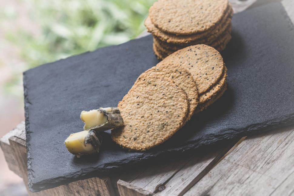 Free Image of Stack of Cookies on Wooden Table 