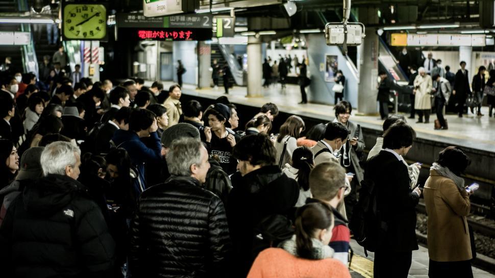 Free Image of Group of People Standing on Train Platform 