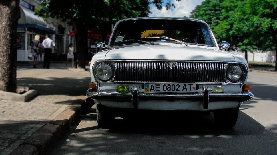 Free Image of White Car Parked on Side of Road 