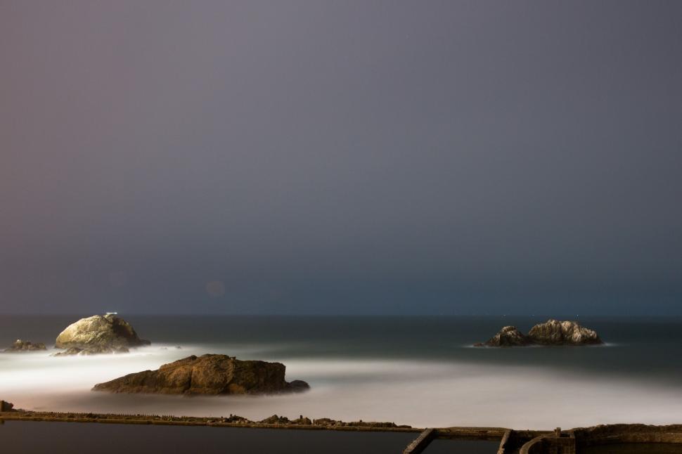 Free Image of Rocky Shoreline and Vast Body of Water 