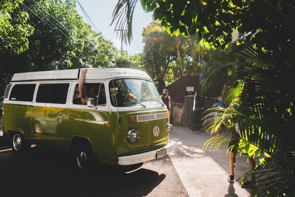 Free Image of Green and White Van Parked on Side of Road 