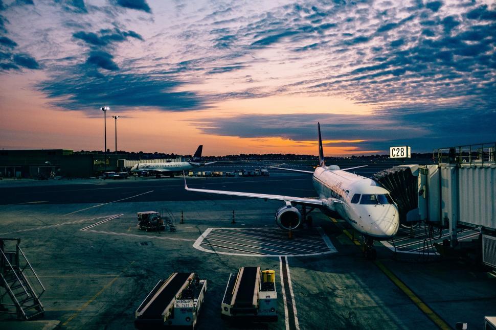 Free Image of Airplane Parked on Tarmac at Airport 