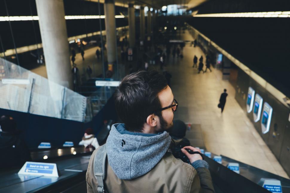 Free Image of Man With Scarf Looking at Something 