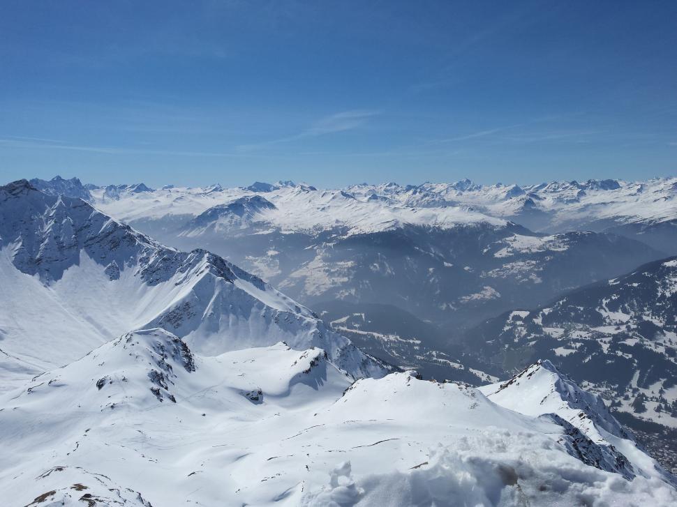 Free Image of A View of a Snowy Mountain Range From a Plane 