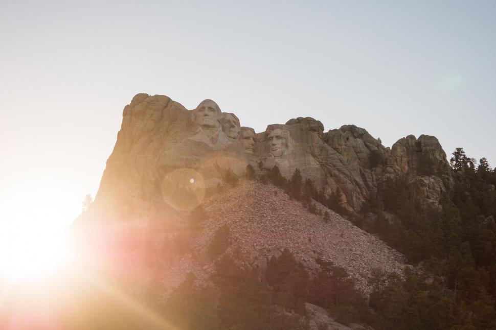 Free Image of Sun Shining Behind Mountain Peak 