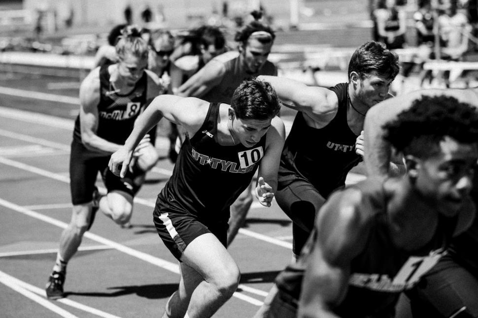 Free Image of Group of Men Running on a Track 