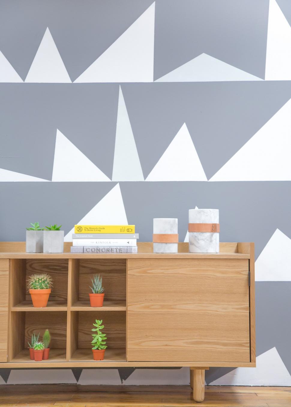 Free Image of Modern Sideboard With Shelf and Potted Plant 