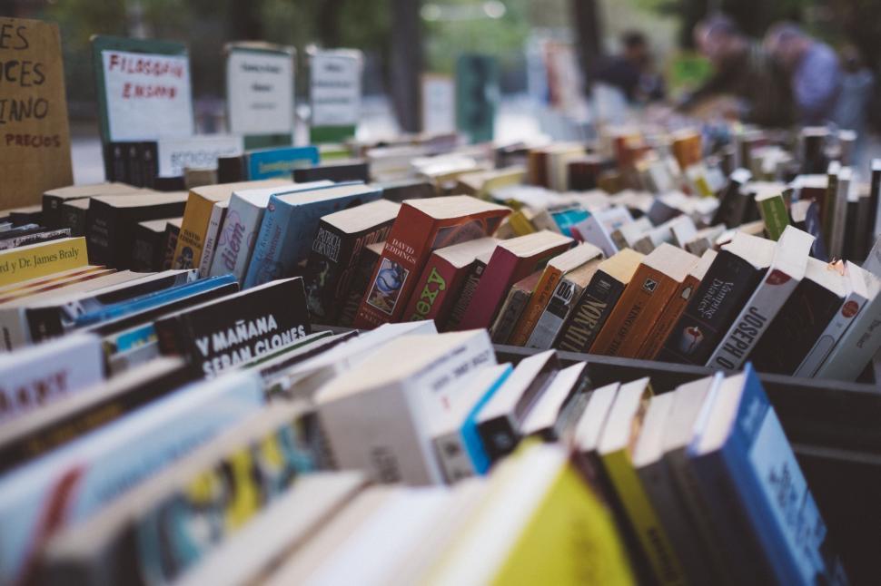Free Image of Row of Books on Sidewalk 