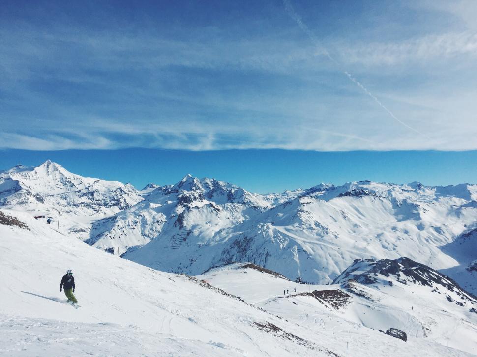 Free Image of Man Skiing Down Snow-Covered Slope 