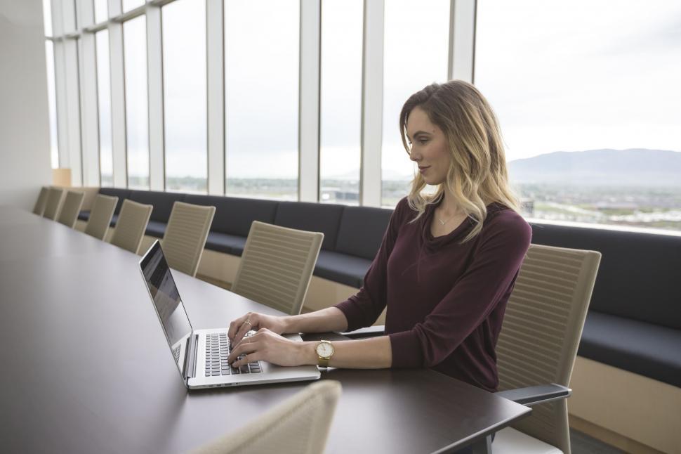Woman sitting on desk stock image. Image of person, attractive