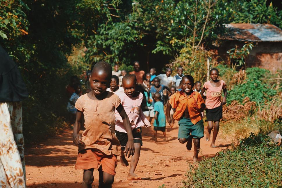 Children running on a dirt road