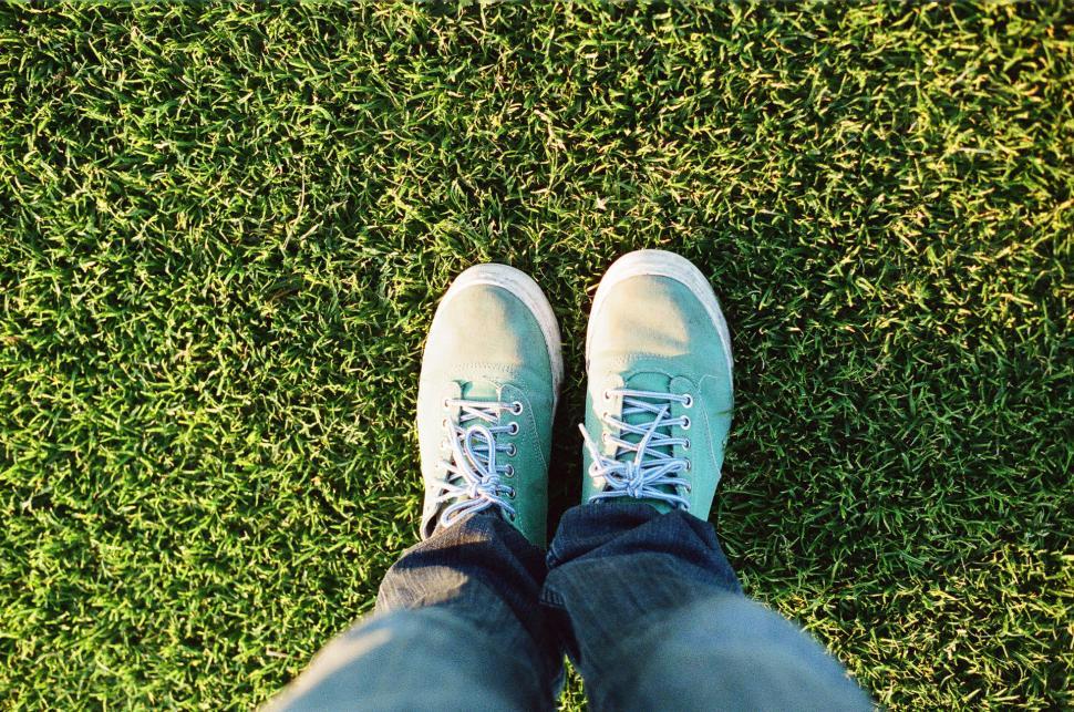 Free Image of Person Standing on Top of Lush Green Field 