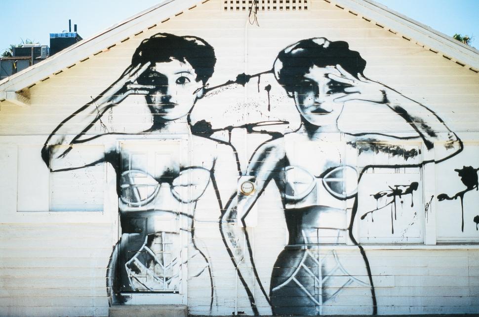 Free Image of Two Women Standing Next to Each Other 