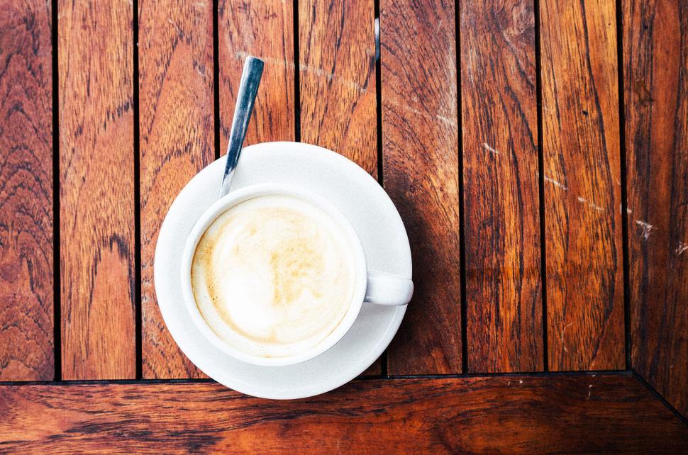 Free Image of A Cup of Coffee on a Wooden Table 
