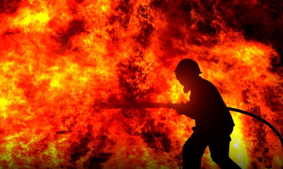 Free Image of Firefighter Fighting a Raging Wildfire - Silhouette 
