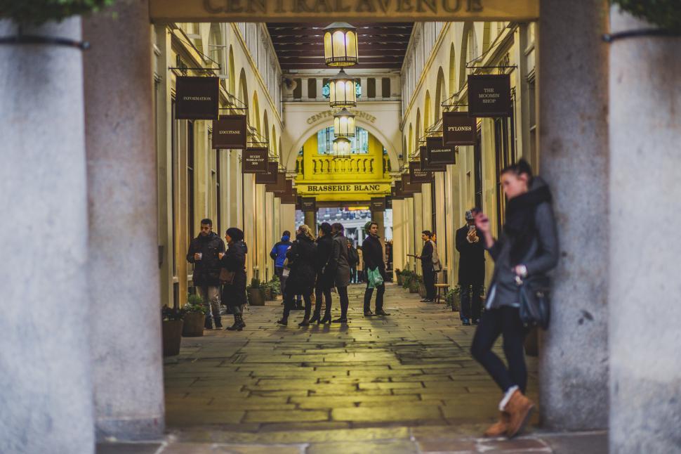 Free Image of Group of People Walking Down a Hallway 