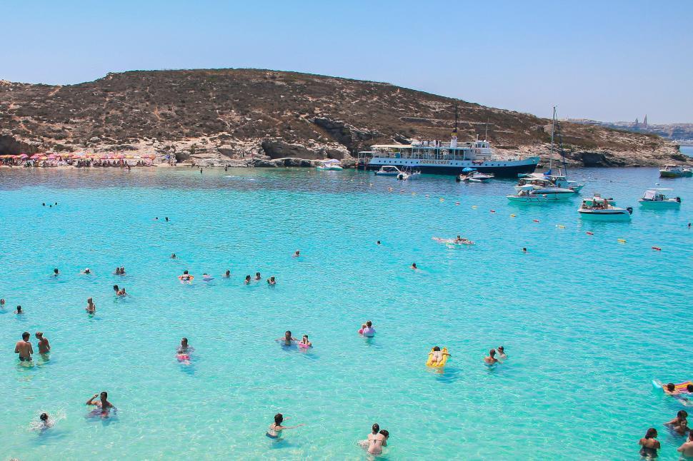Free Image of Large Group of People Swimming in a Lake 