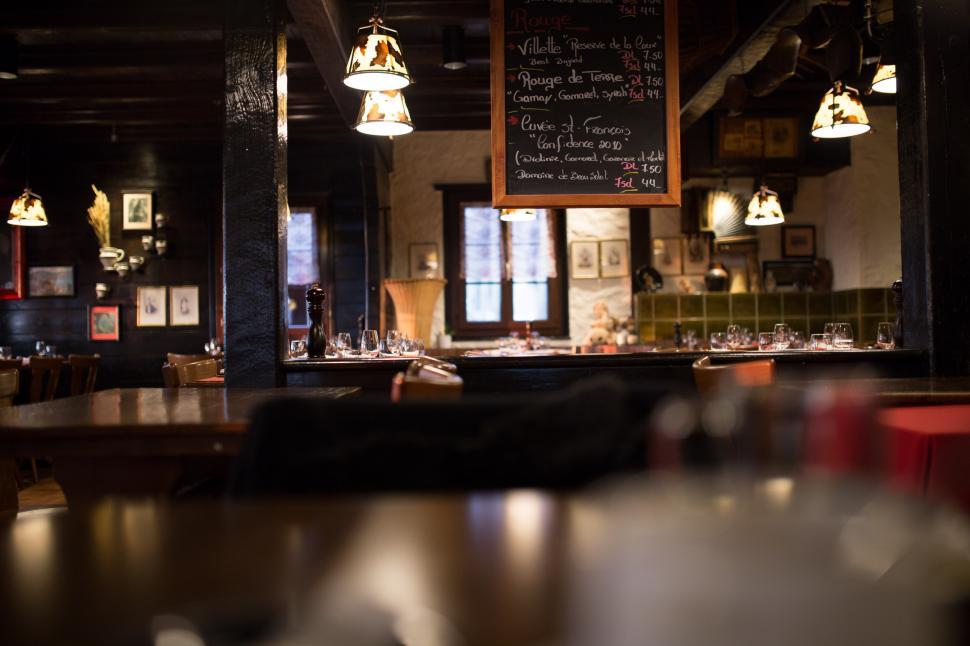 Free Image of Blurry View of a Restaurant With Tables and Chairs 