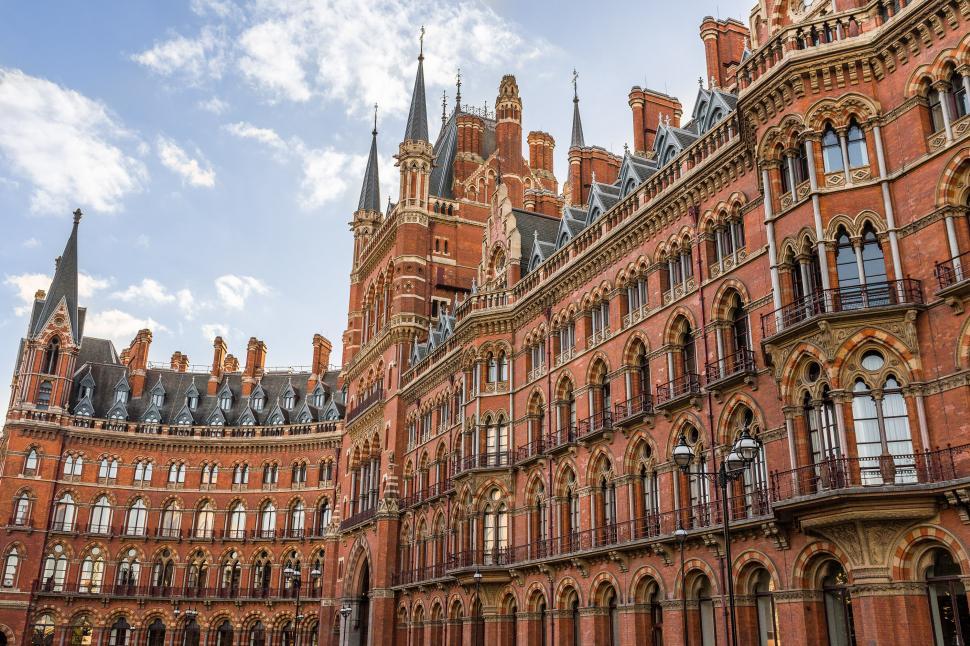 Free Image of Large Red Brick Building With Many Windows 