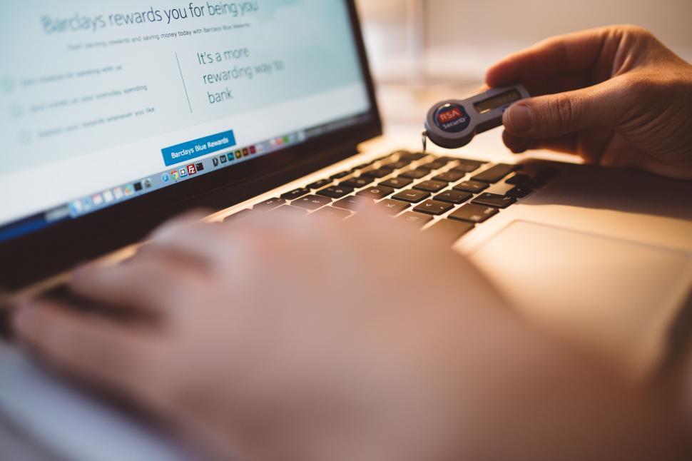 Free Image of Person Using Laptop With Remote Control 