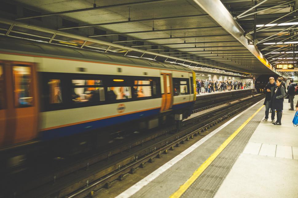 Free Image of Group of People Standing on Platform Next to Train 