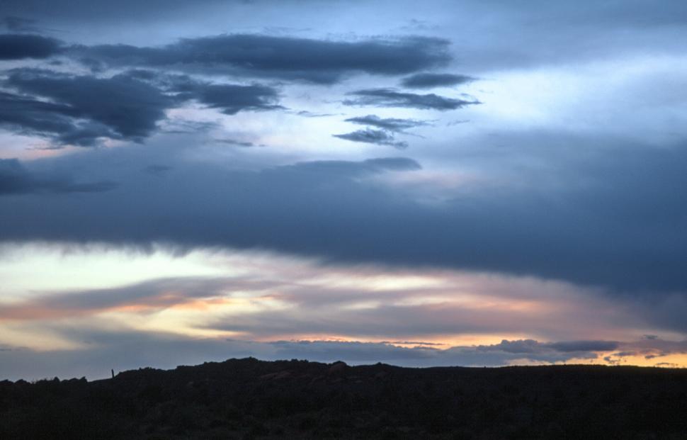 Free Image of Sunset over this hills 