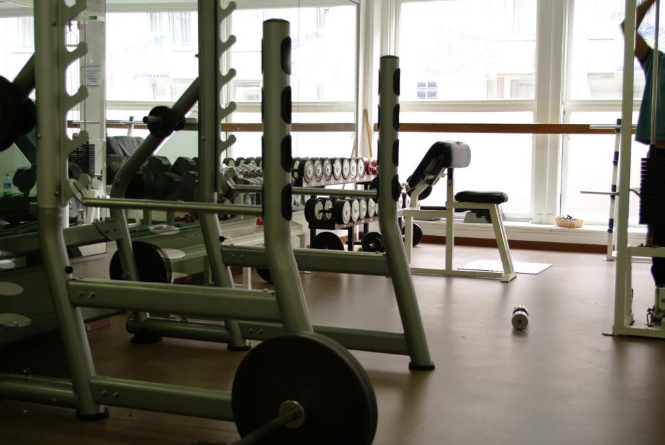 Free Image of Row of Exercise Equipment in a Gym 