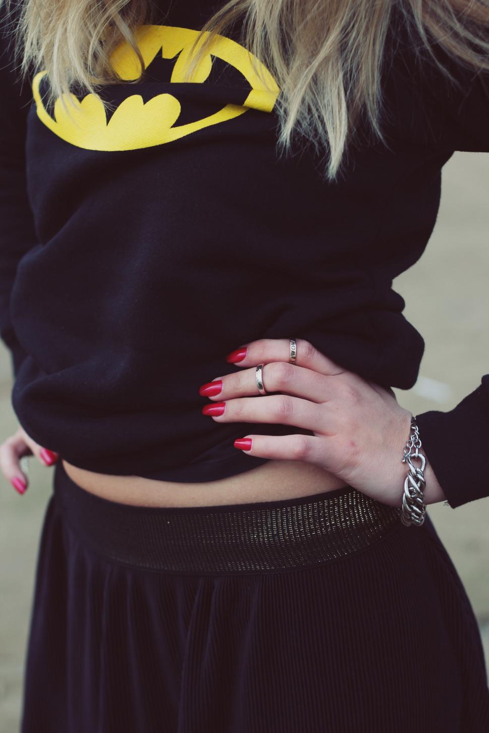Free Image of Woman Wearing Batman Sweater and Skirt 