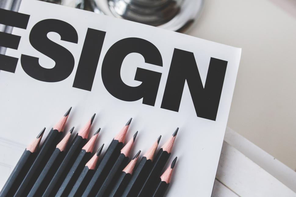 Free Image of Pencils on Top of Magazine 