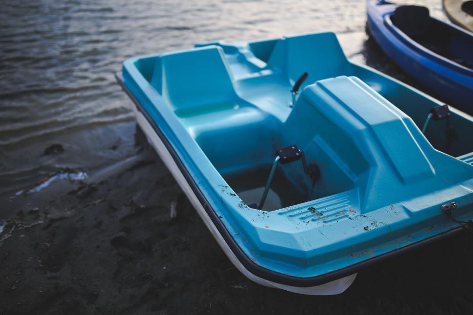 Free Image of Blue Boat on Beach Next to Another Boat 