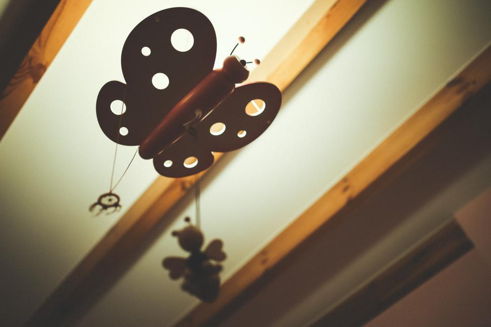 Free Image of Clock Hanging From Ceiling in Room 