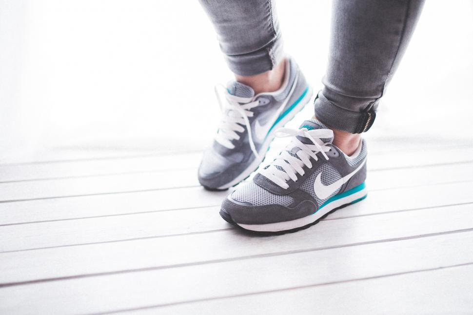 Free Image of Person Standing on Top of Wooden Floor 
