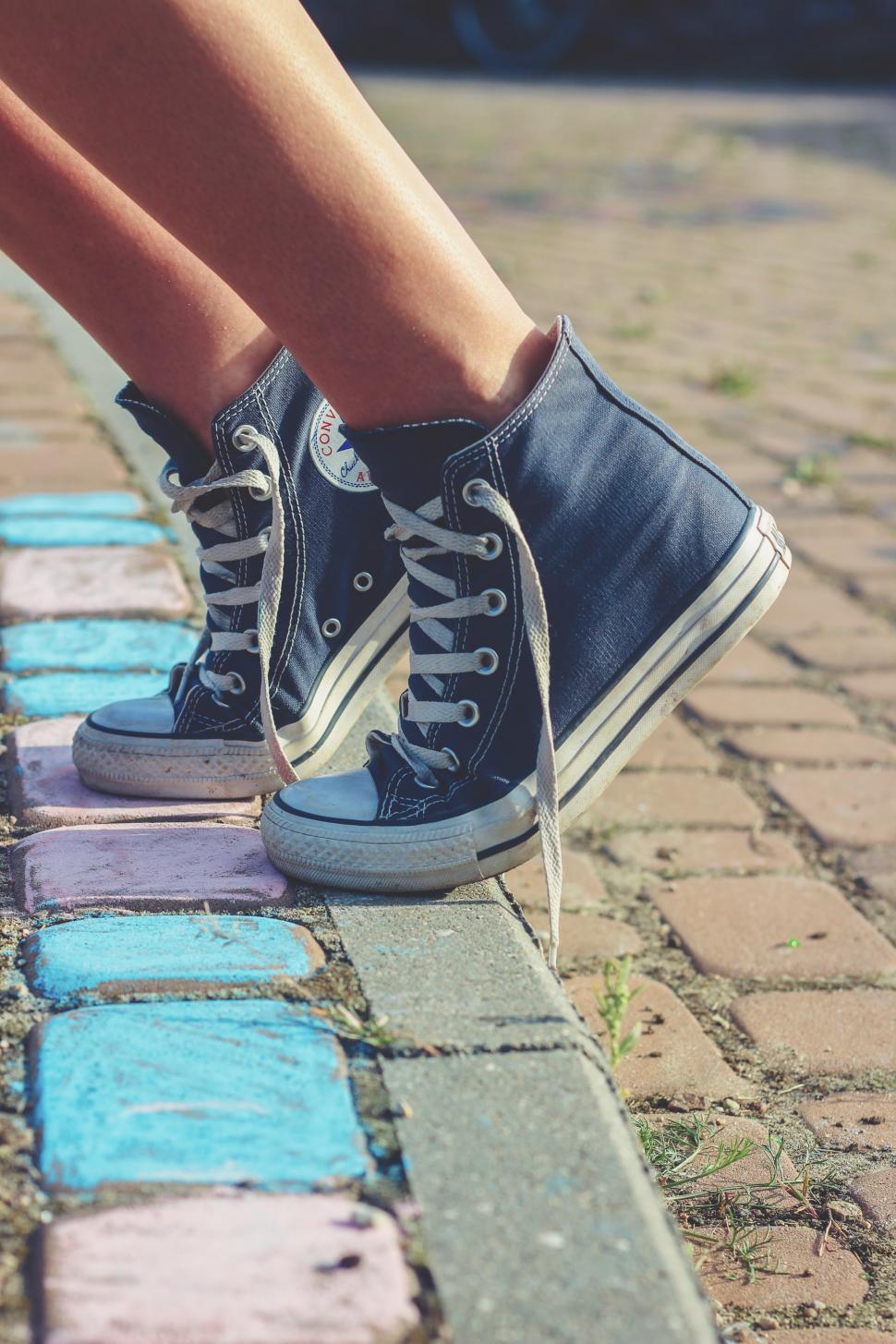 Free Image of Persons Legs and Shoes on Sidewalk 