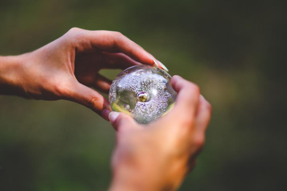 Free Image of Person Holding Piece of Glass 