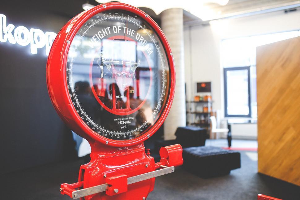 Free Image of Red Clock in Middle of Room 
