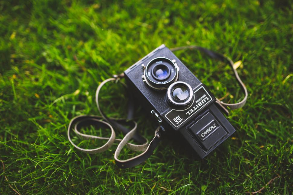 Free Image of Camera on Lush Green Field 