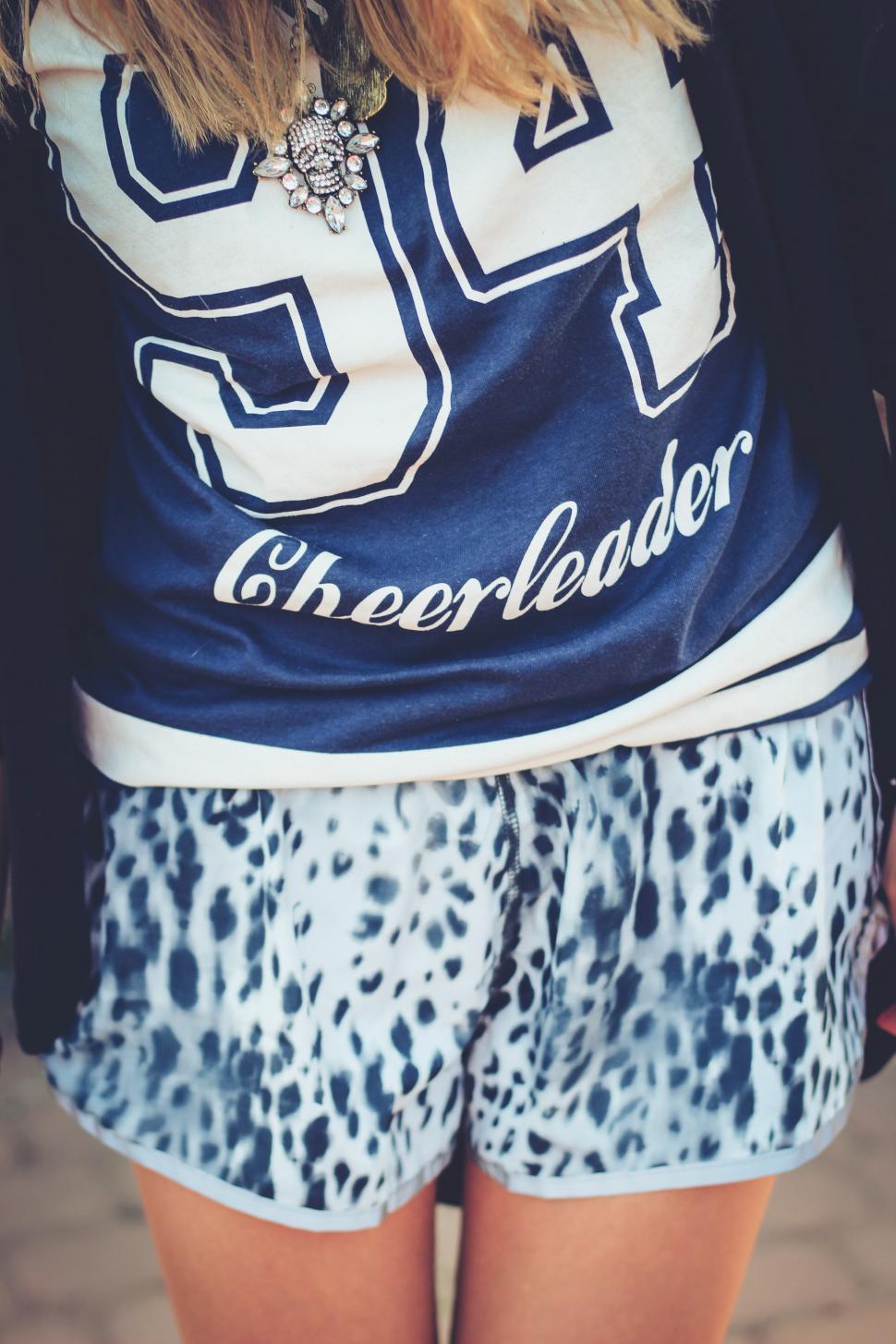 girl-in-cheerleader-shirt-and-leopard-print-shorts.jpg