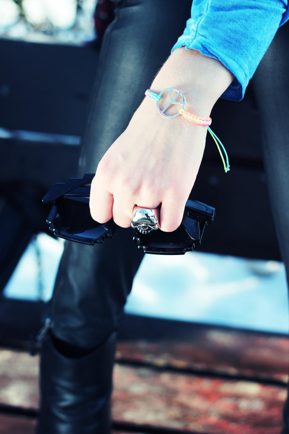 Free Image of Woman Holding Black Purse 