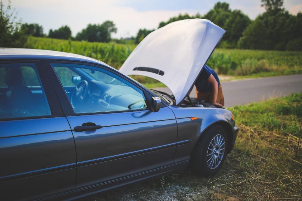 Free Image of Car With Open Hood on Side of Road 