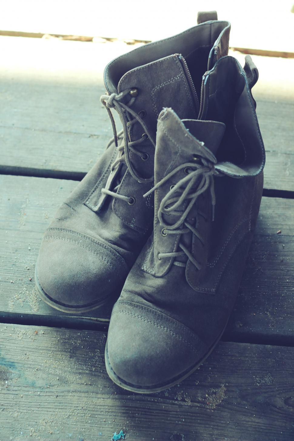 Free Image of Pair of Shoes on Wooden Floor 
